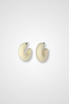 A pair of hoop earrings, white in color and Chunky design in plastic