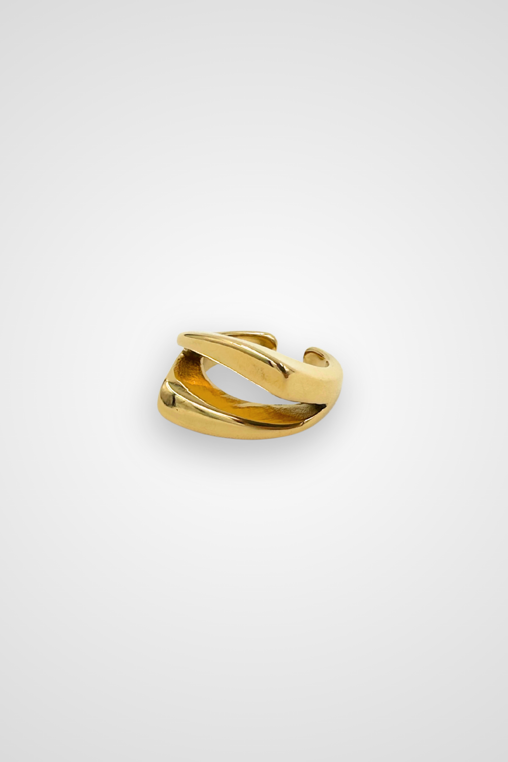 A stainless steel ring with gold colored finish, edgy design