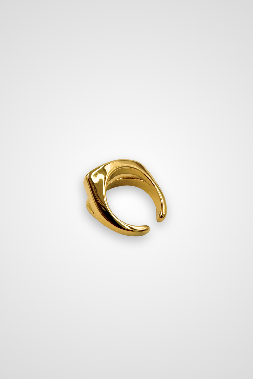 A stainless steel ring with gold colored finish, edgy design
